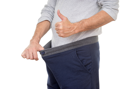 56578116 - old man looking in his pants and showing thumbs up